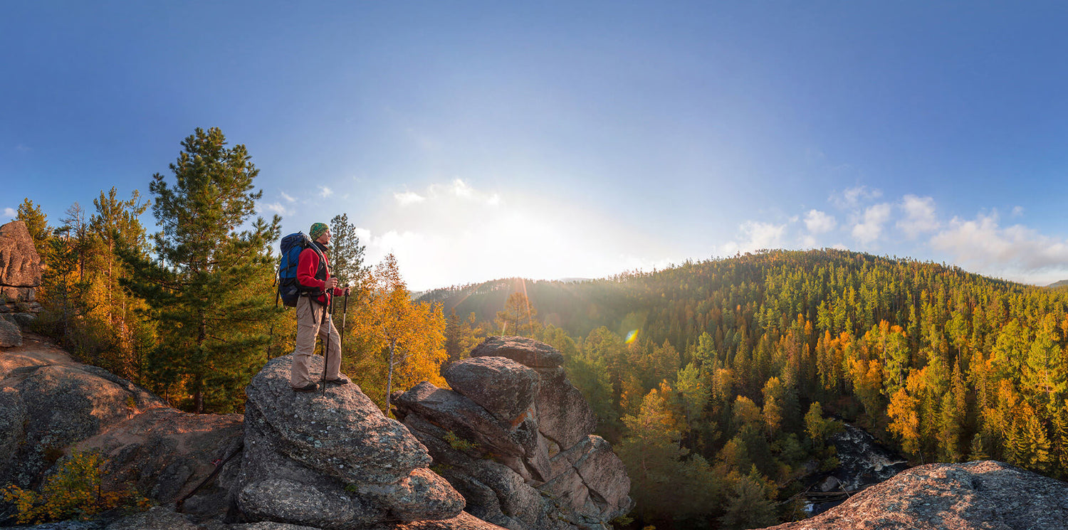Backpacker enjoying autumn wilderness hiking adventure perfect for lightweight freeze-dried camping meals